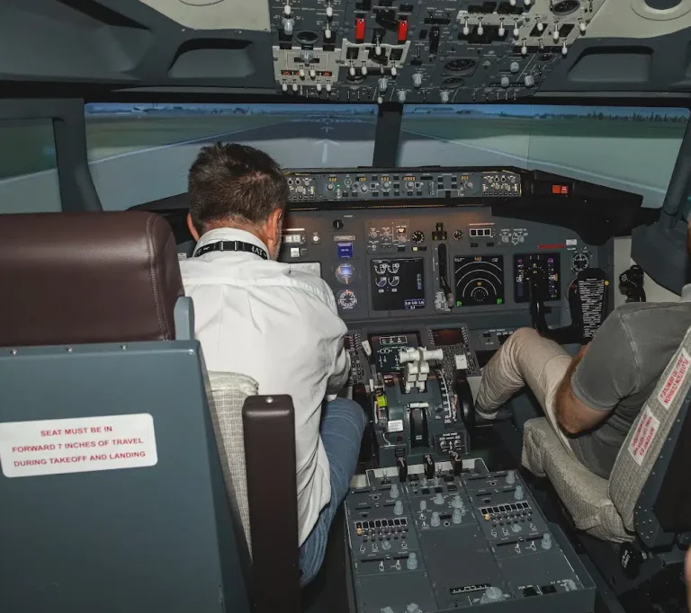 Student preparing to become an airline pilot during advanced simulator training.